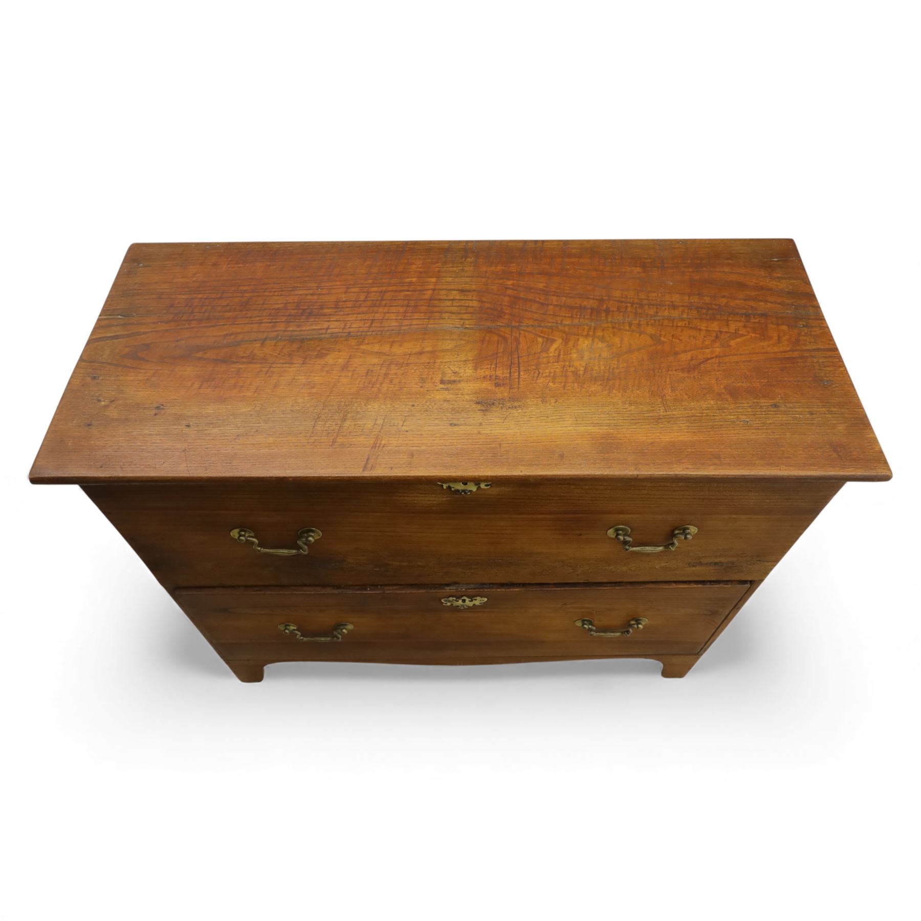 18th century style oak mule chest, the hinged rectangular top opening to a plain interior, above a lower section fitted with two long drawers with brass swan neck handles and shaped escutcheons, upon shaped bracket feet