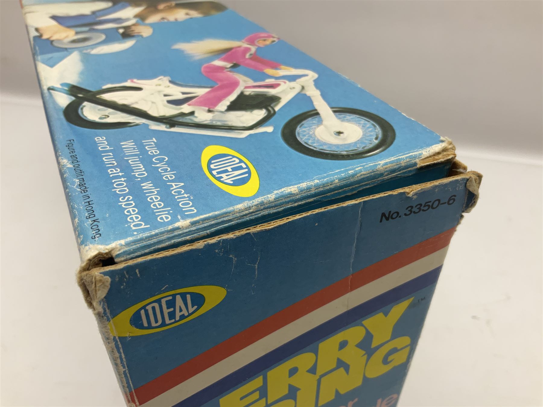 Ideal Derry Daring and Her Trick Cycle, with clothed figure on trick cycle and winder; in original illustrated box dated 1975