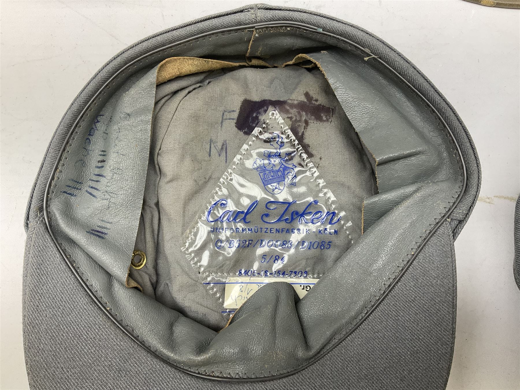 Five reproduction German WW2 hats comprising Wehrmacht olive tropical helmet, Heer officer's peaked cap, two M43 caps and Field side cap (5)