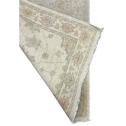 Persian Zeigler runner, ivory ground decorated with faint floral design 