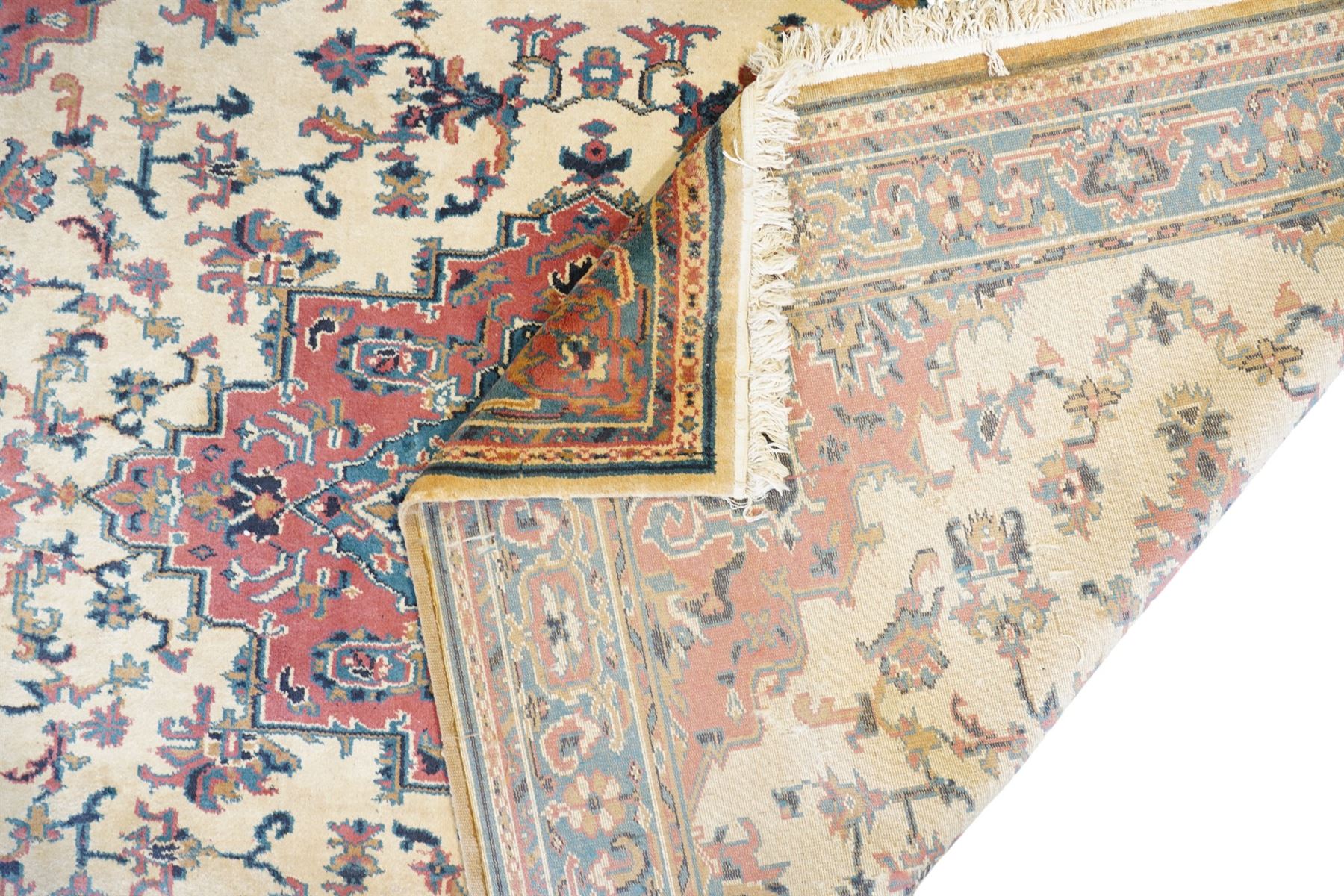 Persian design ivory ground rug with overall floral pattern (275cm x 183cm); contemporary beige ground rug decorated with stripes (175cm x 125cm)