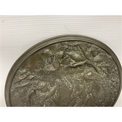 Late 19th century bronze plaque, of circular form, depicting the angel appearing to Adam and Eve in the garden of Eden in high relief, D25.5cm
