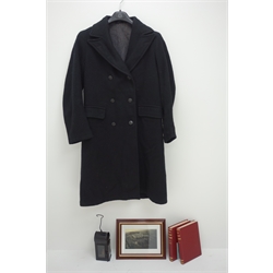  Train driver's black overcoat of double breasted form with six BR buttons, BR(E) black painted hand lamp with kerosene burner H20cm, two volumes by Edward Cecil Poultney entitled Steam Locomotion c1951 in delivery box with book of coupons and framed photograph of Goole Railway Station (4)  