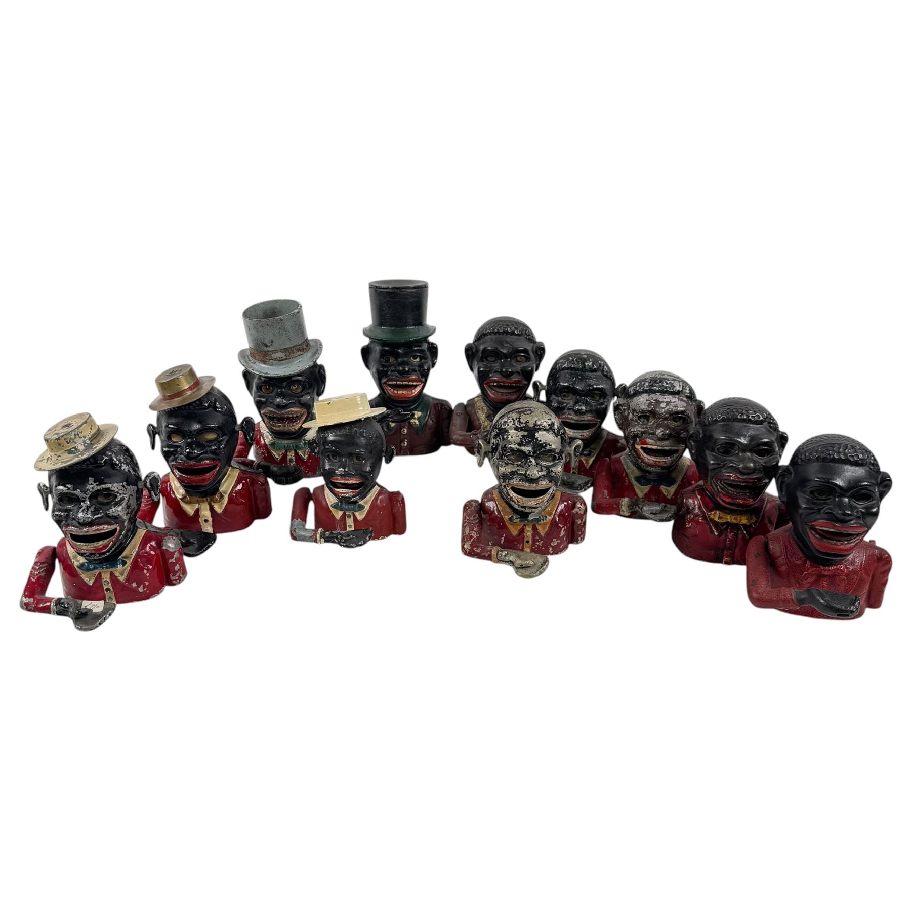 Collection of cast iron Jolly money boxes with and without hats