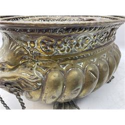 19th century repoussé brass jardinière with lion mask ring handles, of oval form raised upon four claw feet, L31cm