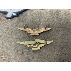 WW1 British Army Derby Scheme 1915 Attested armband; beret with East Yorkshire cap badge; pair of fur lined leather flying/motorcycle goggles; HMS Pembroke cap band; and small quantity of RNAS cloth and metal badges etc