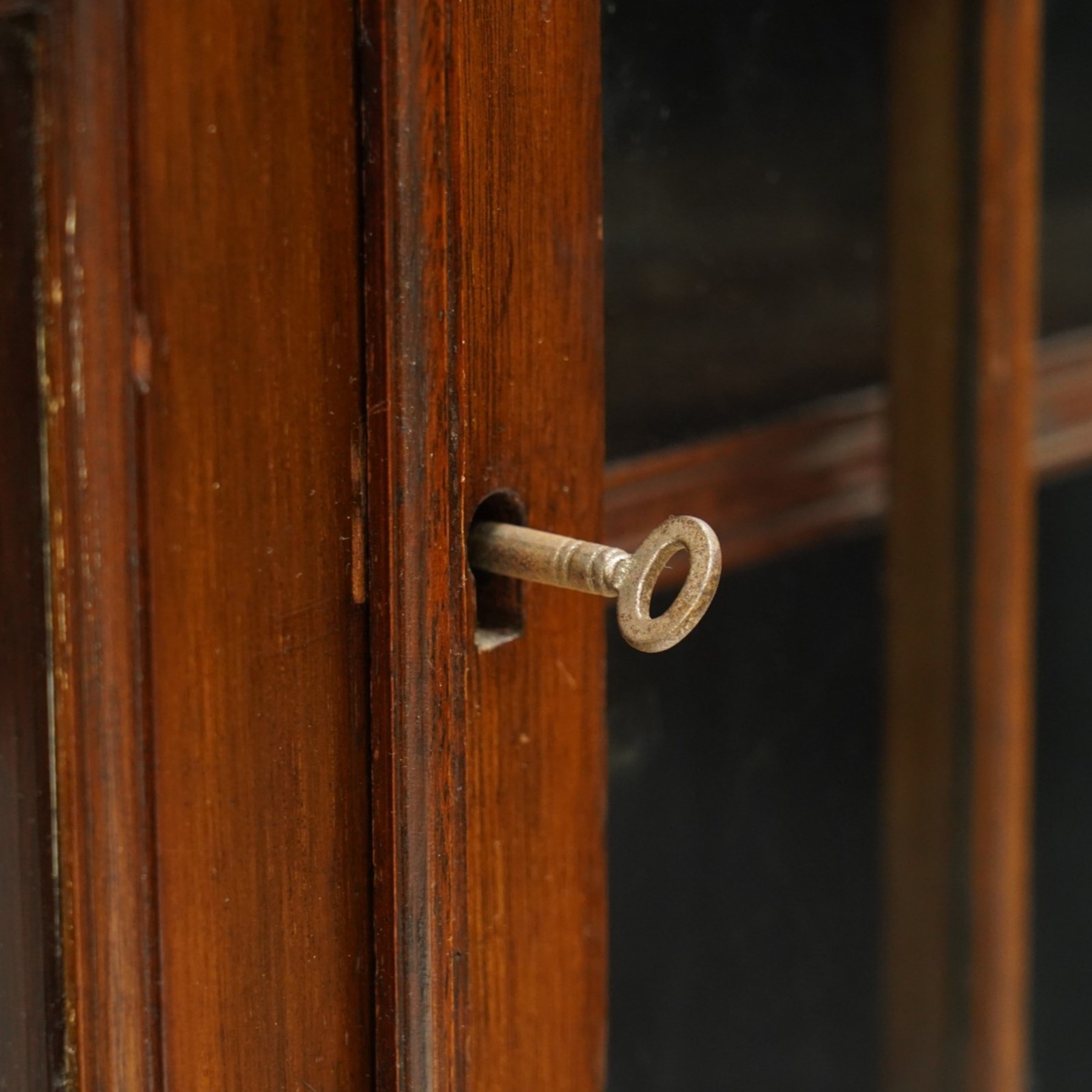 Late 19th century mahogany bookcase, fitted with two drawers over twin astragal glazed doors, enclosing three adjustable shelves, on bracket feet