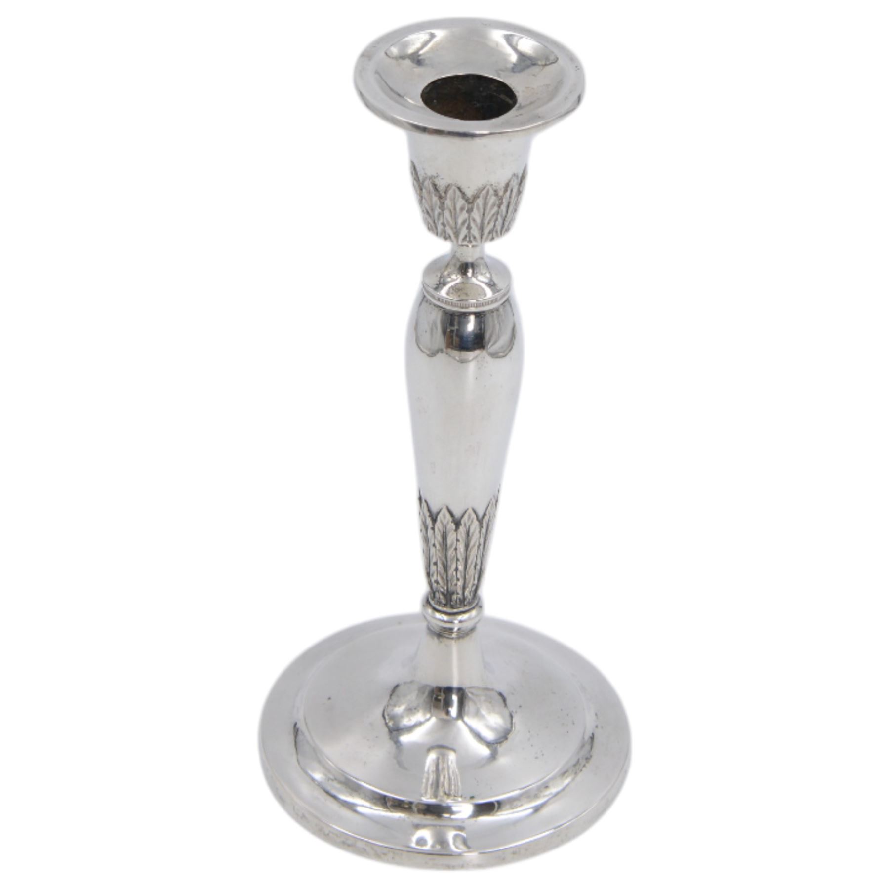 Pair of continental silver candlesticks, probably German Hanau, each of tapering form, with fern leaf decoration, upon a stepped circular base, with Hanau marks and assay scrape to base, H19cm