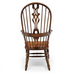Late 20th century elm and beech high back Windsor armchair, the arched hoop back with pierced vase shaped splat between turned spindles, shaped arm rail on turned supports, saddle seat, raised on turned legs united by a crinoline stretcher