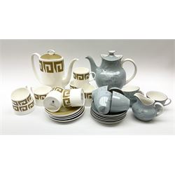 Royal Doulton Forest Glade pattern tea set, comprising teapot, milk jug, open sucrier, six cups and saucers, together with a Wedgwood Susie Cooper tea set, with Greek key decoration, comprising coffee pot, six cups and five saucers, open sucrier and milk jug.