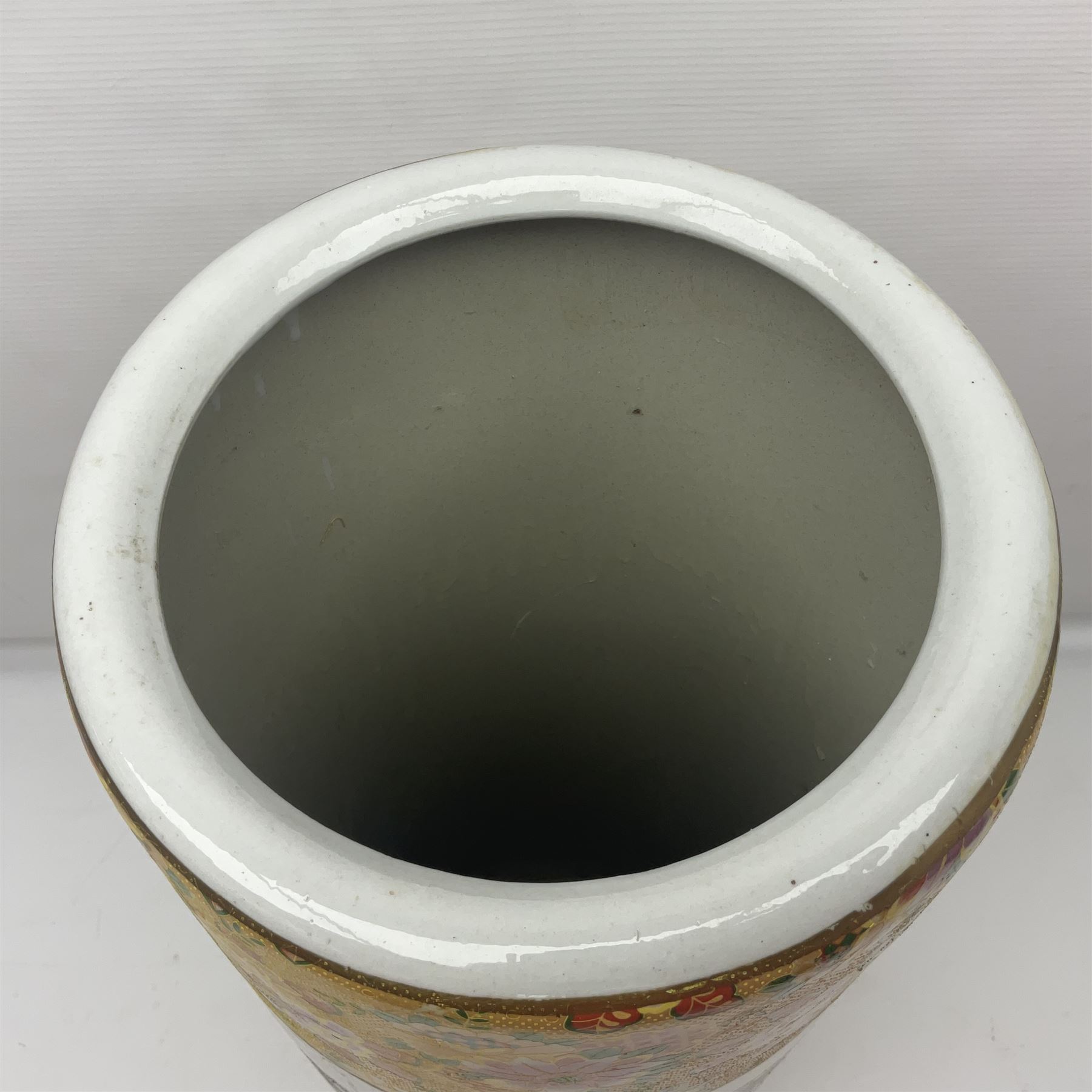 Modern Japanese ceramic umbrella stand, decorated with a figural panel on a yellow floral ground, H60cm