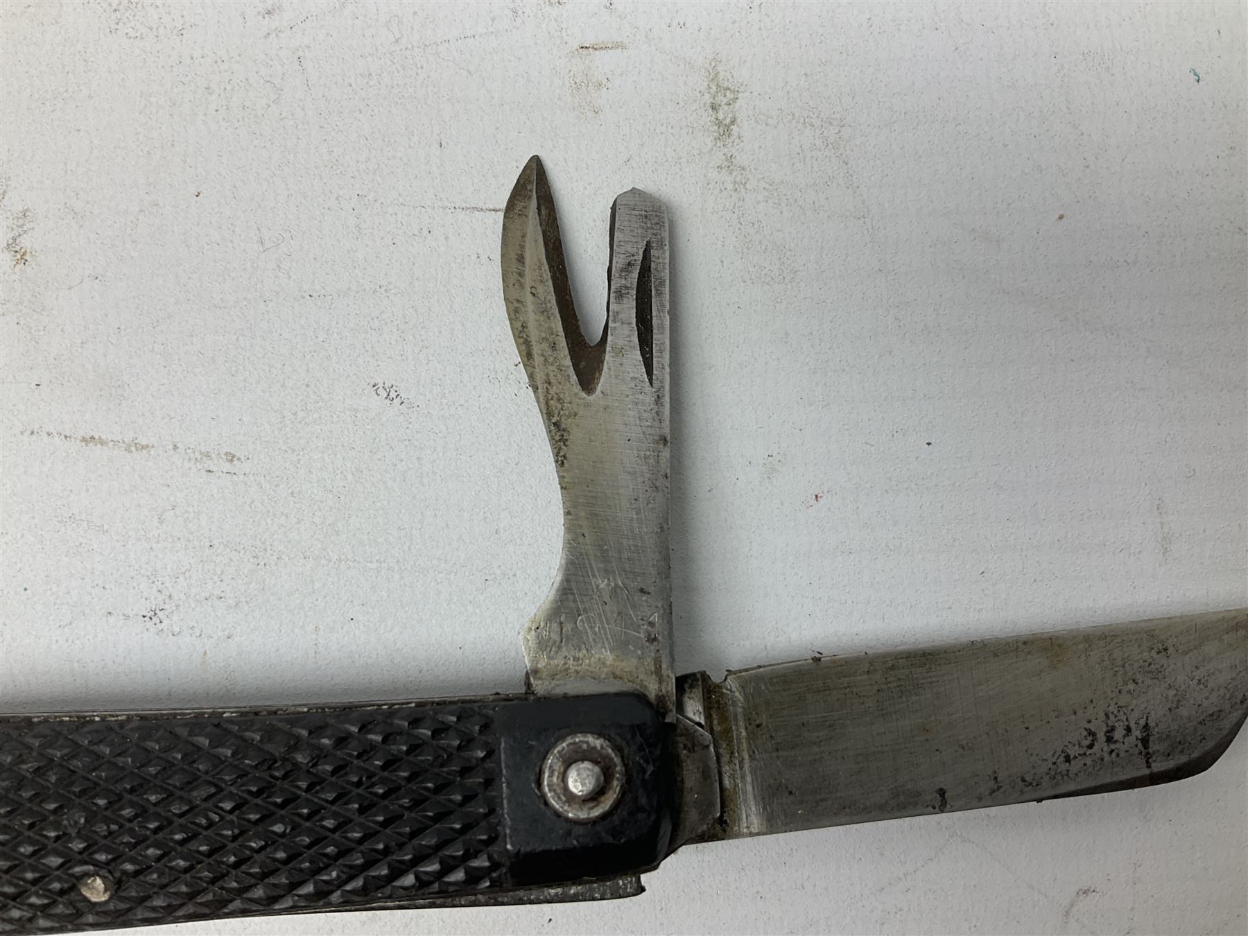WW2 British army folding jack/clasp knife with blade and can opener marked with broad arrow and date 1944; a similar unmarked British army folding three-blade knife; and another later similar British Army knife marked Wade & Butcher Sheffield England (3)