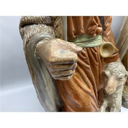 Nativity scene painted plaster figures, comprising of kneeling shepard, two kneeling kings and one standing king, with impressed mark 'La Statue Religieuse Paris', together with a plaster sheep, tallest figure 98.5cm. 
