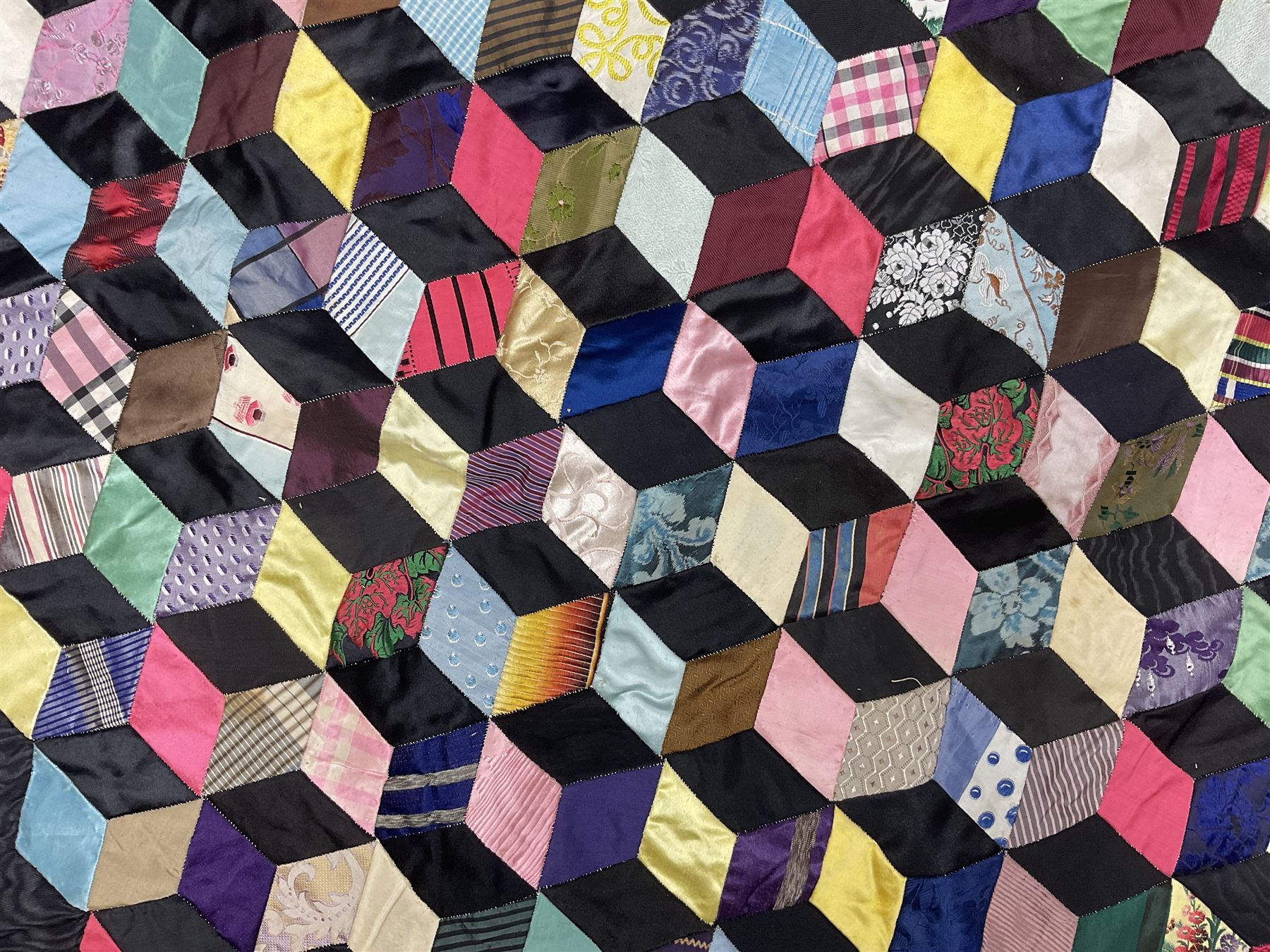 19th Century silk and satin tumbling blocks pattern patchwork quilt with black border 228cm X 196cm