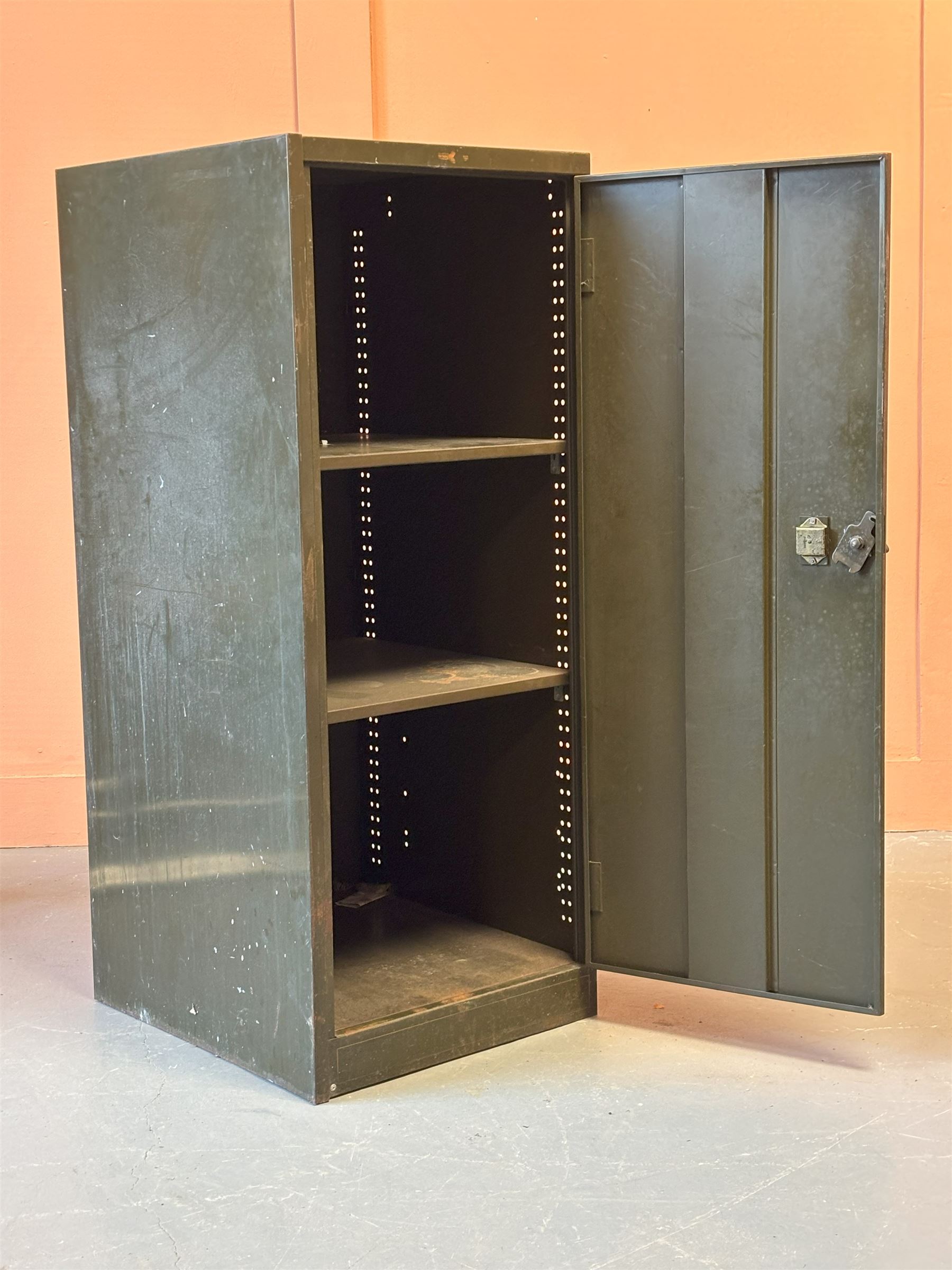 Green and gilt painted steel office cabinet, mid 20th century, the door opening to two adjustable shelves, complete with brass handle and key. H132cm, W54cm, D63cm. - COLLECTION BY APPOINTMENT FROM: The White House, Thirsk Road, Easingwold, York, YO61 3NF - CALL 01723 507111 TO ARRANGE
