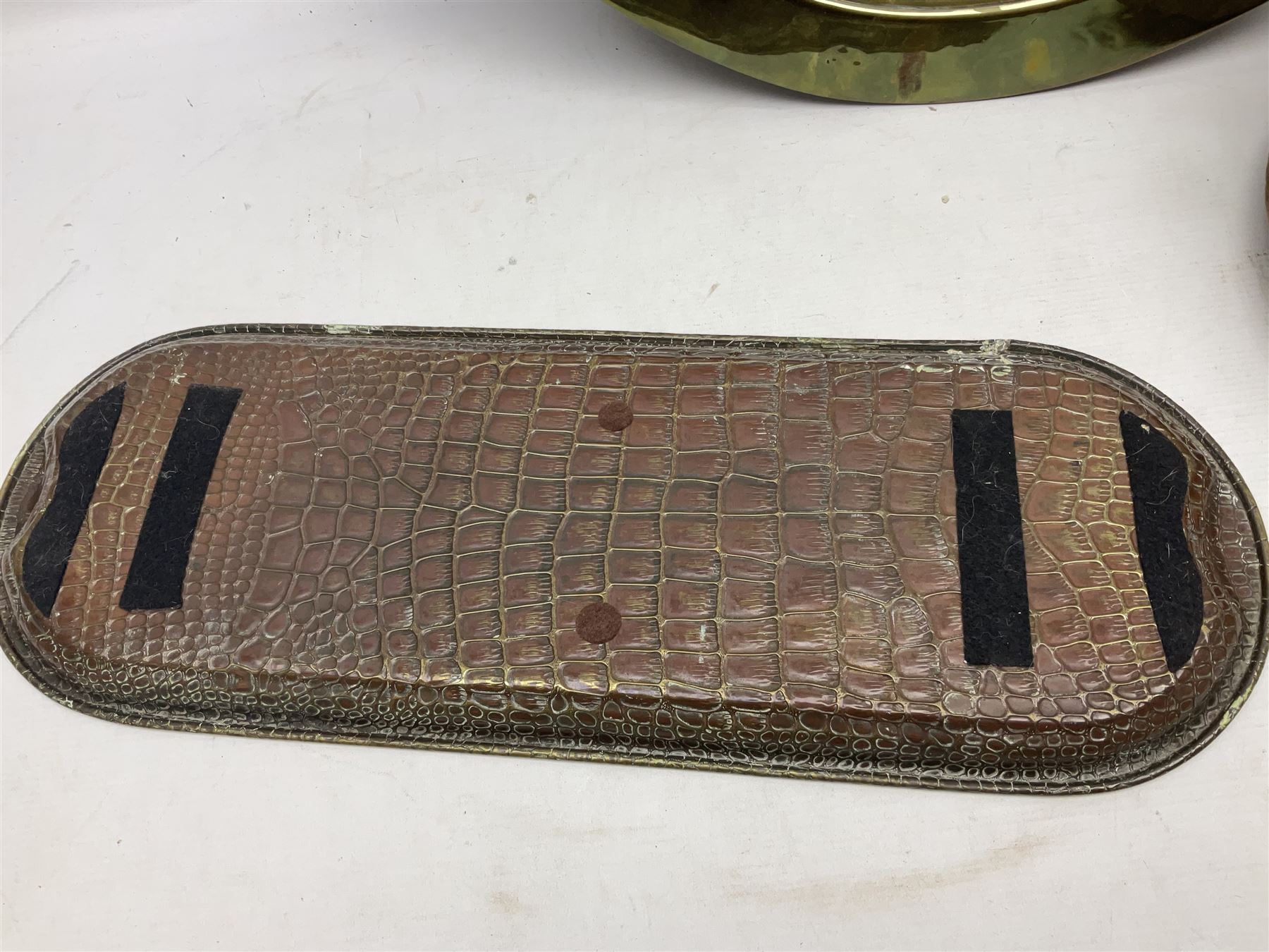 Copper pot with twin iron handles, large heavy planished brass charger and brass crocodile tray, charger D59cm