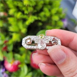 Early 20th century platinum diamond brooch, milgrain set with a pear cut faint brown diamond of approx 1.50 carat, an old cut fancy yellow / green diamond of approx 0.70 carat, and two old cut fancy orange / brown diamonds of approx 0.40 carat and 0.35 carat, surrounded by old cut white diamonds in an openwork setting, total white diamond weight approx 1.45 carat