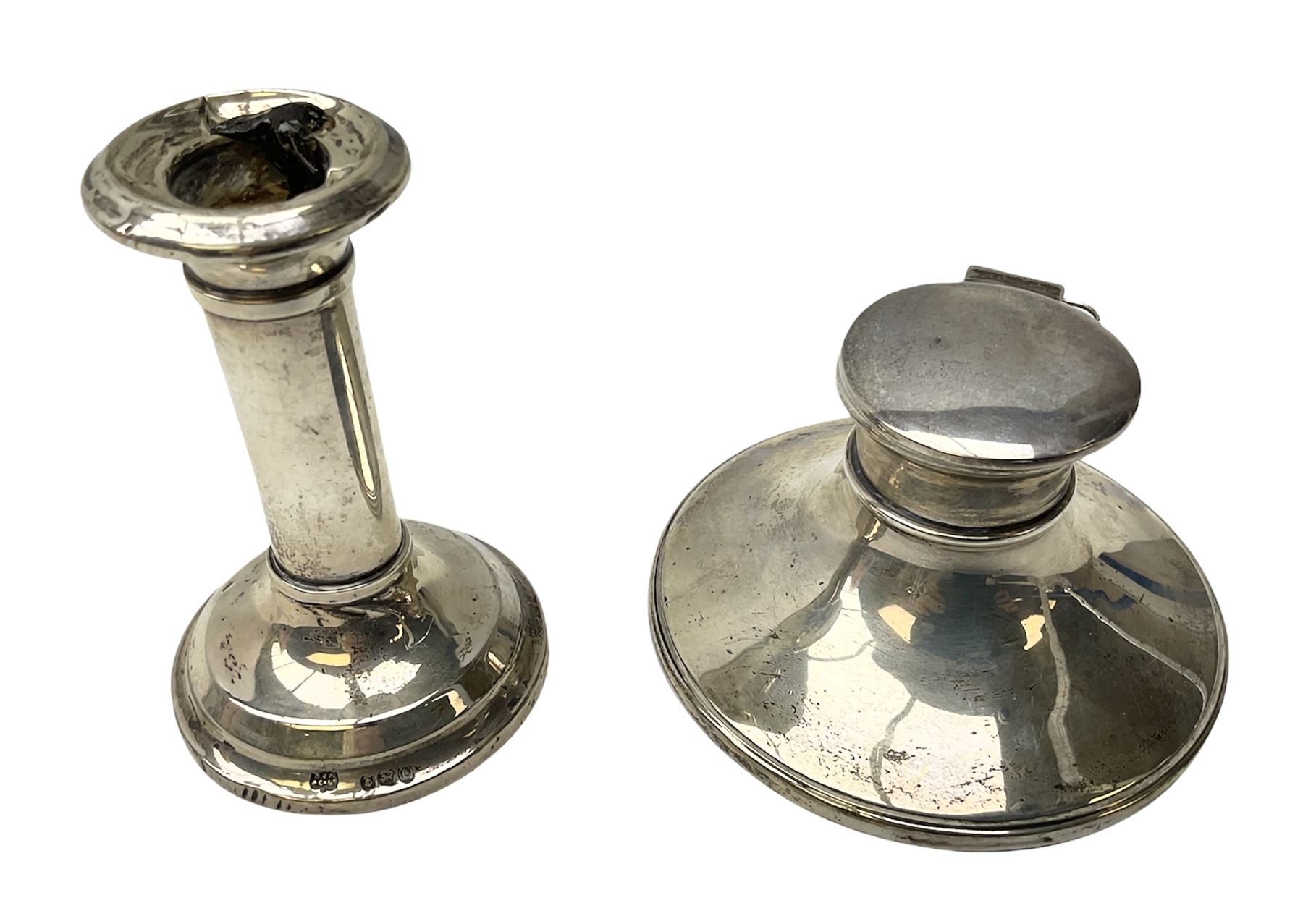 1920's silver mounted capstan inkwell, hallmarked Charles Boyton & Son Ltd, London 1929, together with an early 20th century silver mounted dwarf candlestick, hallmarked A J Pepper & Co, Birmingham 1918