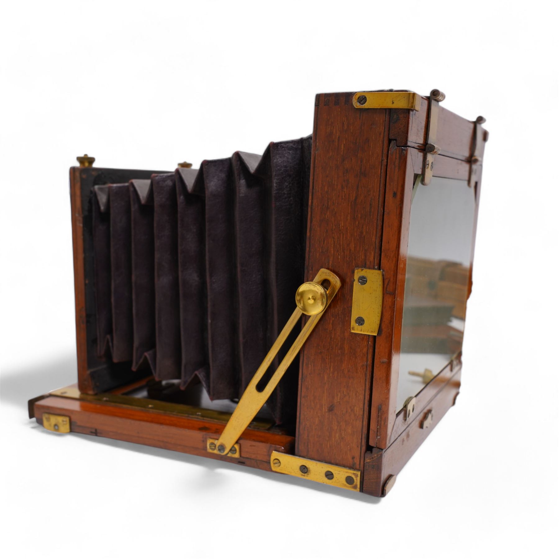 Victorian mahogany and brass bound cabinet card plate camera, with Ross (Zeiss Patent) lens, with three mahogany plate holders,  and an early 20th century oak tripod. This item has been registered for sale under Section 10 of the APHA Ivory Act
