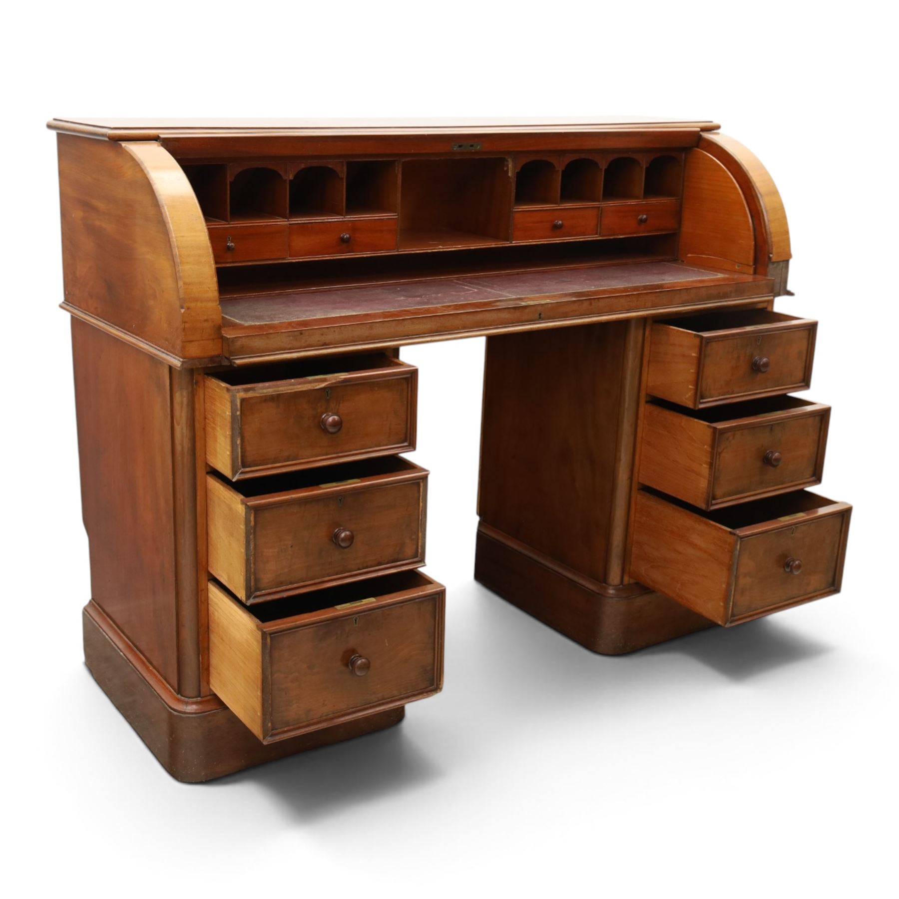 Victorian mahogany twin pedestal cylinder desk, with roll top with fitted interior and with leather writing slide, raised on pedestals with three graduating drawers, raised on a plinth base with castors