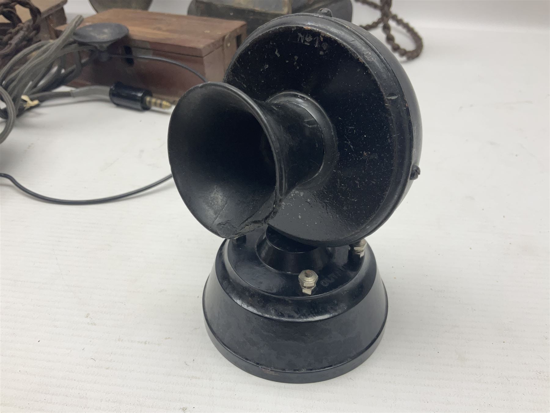 Collection of phone headsets, including GPO bakelite examples, together with other telephone parts 