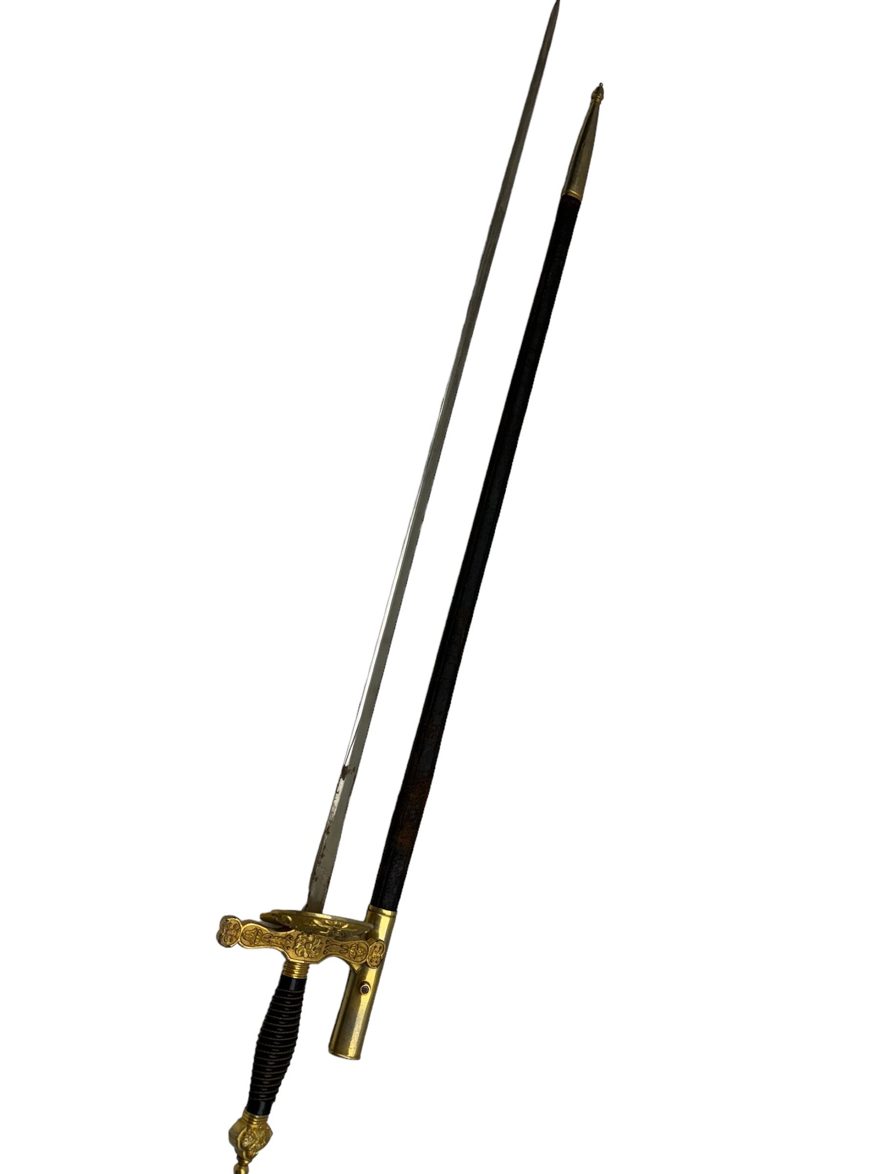 Ceremonial sword, the 75cm blade marked Toledo, Spain, gilt handle with black wire-bound grip  with leather scabbard with gilt tip, L94cm 
