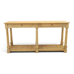 Neptune - 'Edinburgh' limed oak console table, with two
soft close drawers raised on ring...