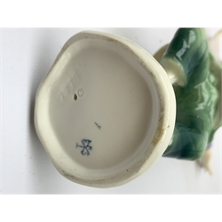 Three 20th century Karl Ens figurines, the first modelled as Uncle Fritz, the second modelled as Bock the Tailor, the third modelled as a sprightly female figure, each with printed blue mark to base, largest H20cm. 