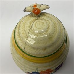 Two Clarice Cliff Bizarre for Newport Pottery, beehive honey pot with cover in Crocus pattern, with printed mark beneath, H9cm