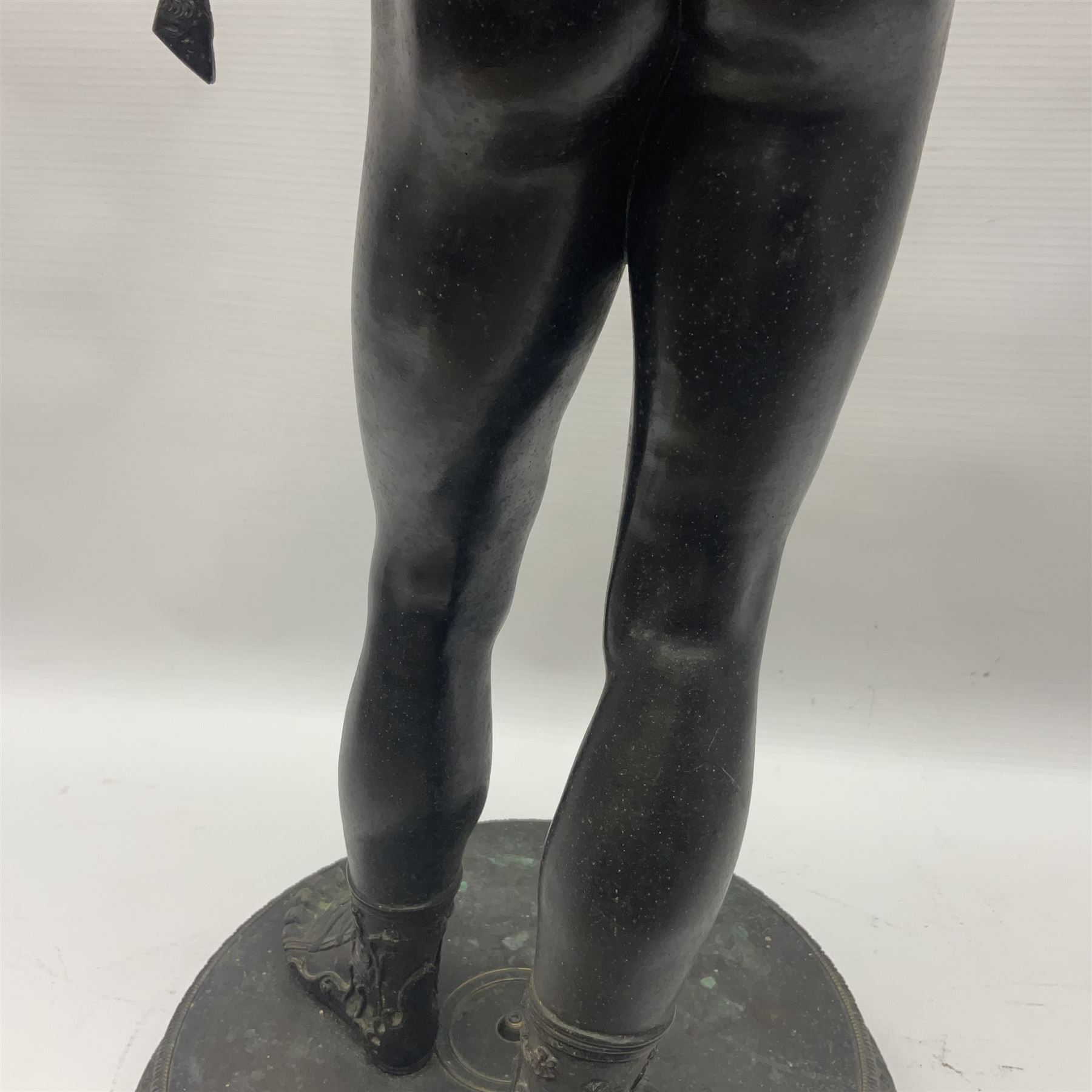 Bronzed classical nude male figure, upon a stepped circular base, H61cm 