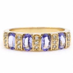 9ct gold tanzanite and diamond half eternity ring, four oval cut tanzanite's, each spaced ...