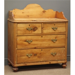  Early 20th century waxed pine washstand, raised shaped back and sides, above two short and three long drawers on bun feet, W94cm, H107cm, D49cm,   