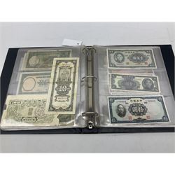 World banknotes, including Queen Elizabeth II The States of Jersey one pound 'DB202703', five pounds 'BB527762' and ten pounds 'AB651481', reserve bank of New Zealand two dollars '1L3 741894', King George V Straits Settlements one dollar 1st January 1935 'F/83 28924', various Bank of England notes etc, housed in two ring binder albums