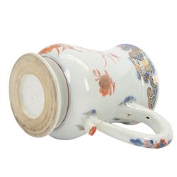 Pair of 18th century Chinese export tankards, each of bellied form with curved handle and circular foot, decorated in the Imari palette with peonies, chrysanthemums and bamboo, H12.5cm