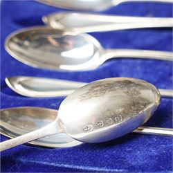 Set of six silver coffee spoons with shaped terminals, cased London 1924, another set of similar spoons London 1924 cased and a set of six silver bead knop spoons Birmingham 1936, cased