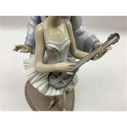 Lladro figure, Minstrel's Love, modelled as a couple entertaining, the lady in ballerina costume playing the lute and the gent stood behind her in jester type dress, sculpted by Rafael Lozano, with original box, no 5821, year issued 1991, year retired 1993, H31cm