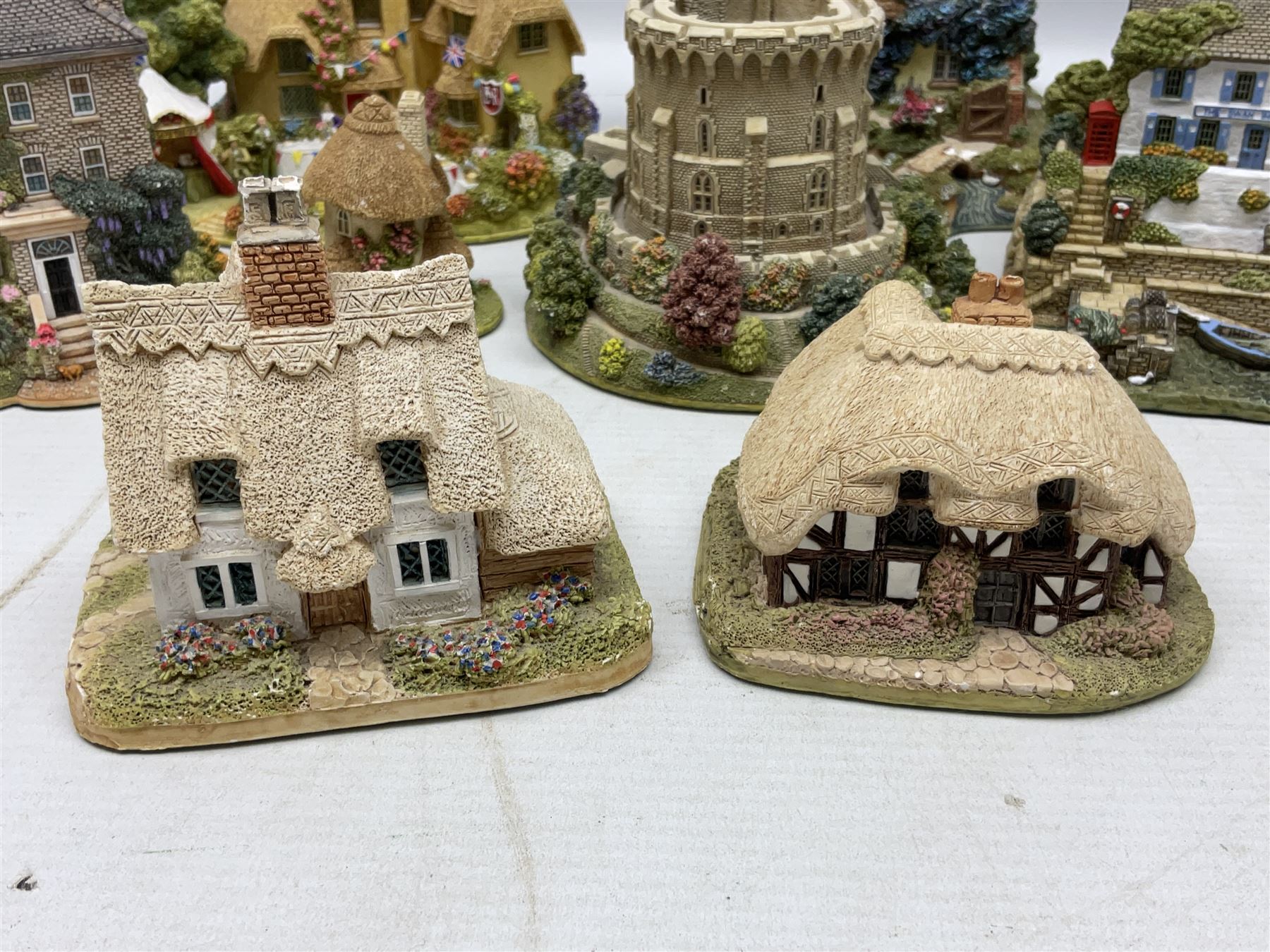 Sixteen Lilliput Lanes, to include The Golden Jubilee, Round Tower - Windsor Castle, Castle of the Golden Chalice, Travellers Rest, with box and deed,  Summer Days, Sunshine Creek, Writing with Lewis Carol, with box and deed,  etc 