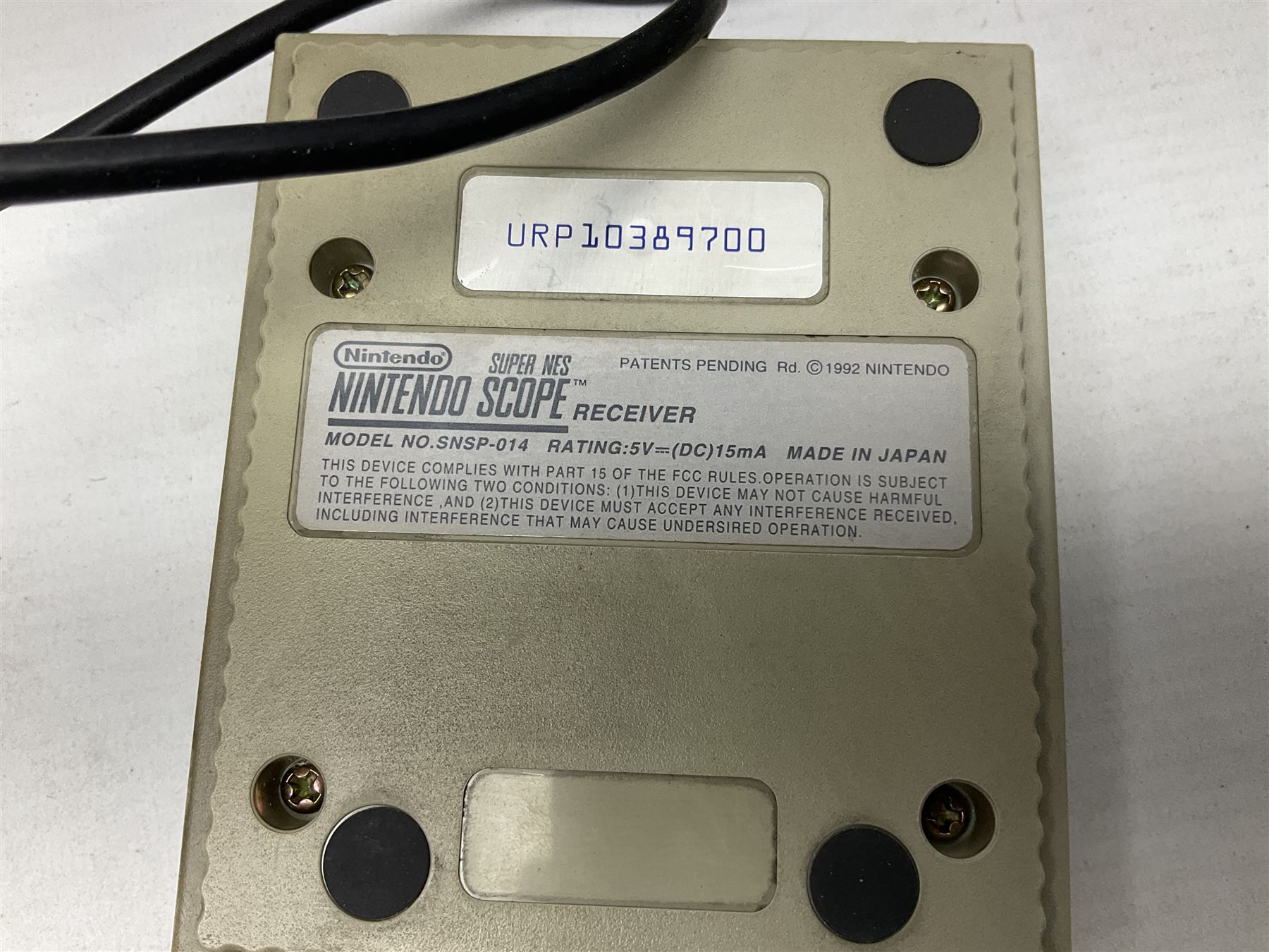 Two Super Nintendo Entertainment System (PAL) controllers, accessories and games. Super NES Game Commander with original box and instruction booklet, Super NES Nintendo Scope (1992) transmitter gun, receiver, Super NES Nintendo Scope 6 game with original instruction booklets. Further games to include ‘The Legend of Zelda a Link to the Past’, ‘Super Mario World’, ‘Super Mario Kart’, ‘The Lawnmower Man’, and ‘Exhaust Heat’, all with original instruction booklets. ‘PowerMonger’ and Disney’s ‘Aladdin’ game cartridges only 