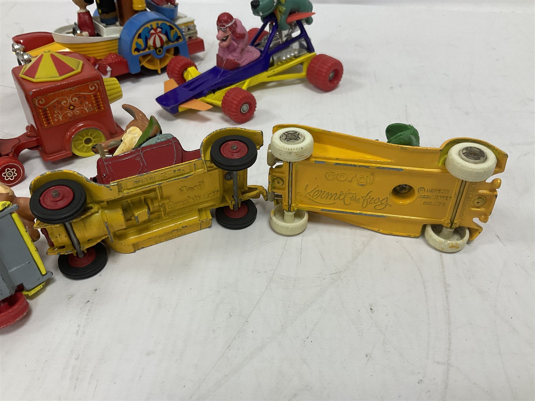 Corgi/Dinky - twelve unboxed and playworn TV/Film related die-cast models including Popeye Paddle Wagon; Dick Dastardly; Magic Roundabout; Muppets; Basil Brush; and Noddy (12)