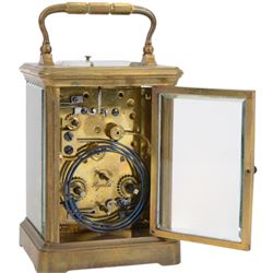 French-19th century 8-day carriage clock in a corniche case, two train striking movement with repeat work and alarm, enamel dial with Roman numerals and five minute Arabic’s, spade hands and alarm setting dial, movement with a lever platform escapement sounding the hours and alarm on a gong. With original case and key.