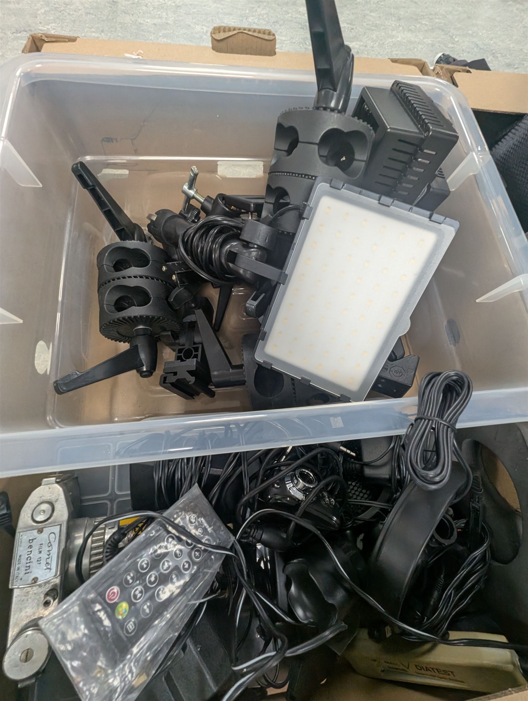 Collection of photography equipment, including flashes, hoods, filters, telephoto lens, bags, etc