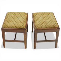Pair of George III mahogany framed coaching stools, the drop-in seats upholstered in green and beige needlepoint fabric, raised on moulded and chamfered square tapering supports united by H-stretcher