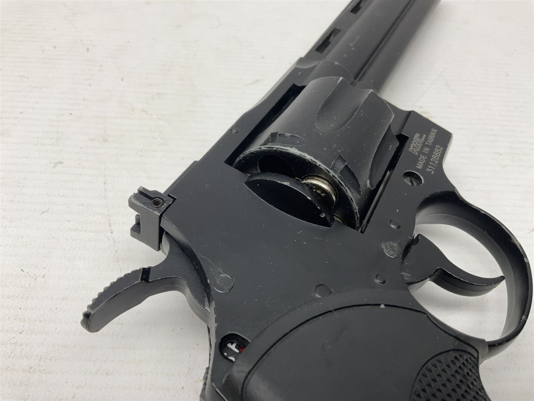 Marksman 1018 spring action BB pistol, serial no.121912951321, L27cm in original packaging with ball dispenser; and KWC .177 cal. CO2 revolver, serial no.31128882, L31cm (2)  NB: AGE RESTRICTIONS APPLY TO THE PURCHASE OF AIR WEAPONS.