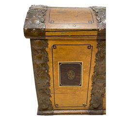 19th century painted oak sea chest, hinged dome top enclosing small compartment, bound by shaped and pressed metal strapwork, scumbled finish to resemble oak and painted with small vignettes depicting portraits and landscapes within panels, fitted with large wrought metal carrying handles, the front inscribed 'H.J.S. 1870' 