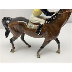 Beswick jockey on walking horse no 1037, in black white and yellow jockey colours, with printed mark beneath, H22cm