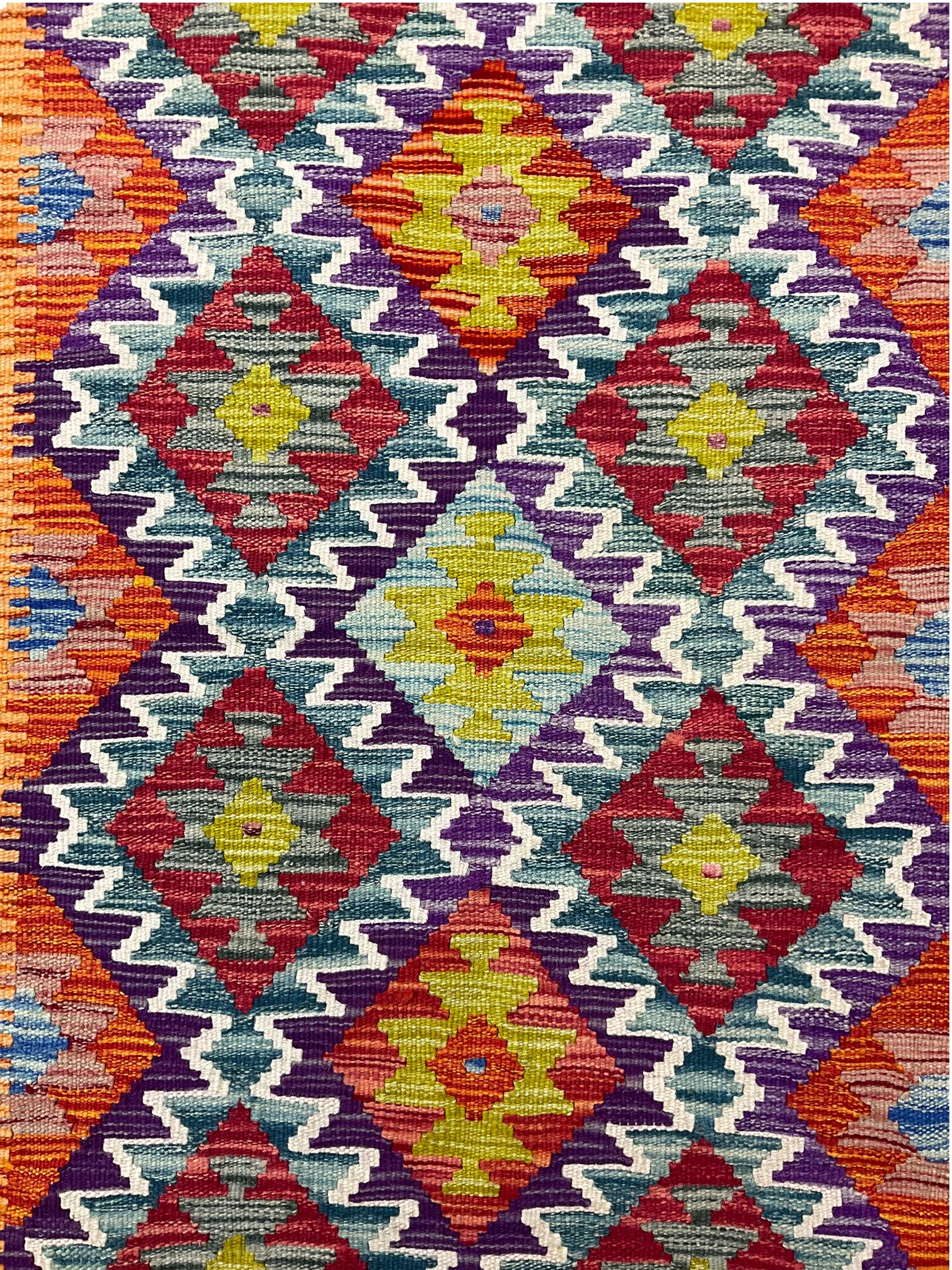 Chobi kilm runner, multi-colour ground, repeating stepped lozenge design