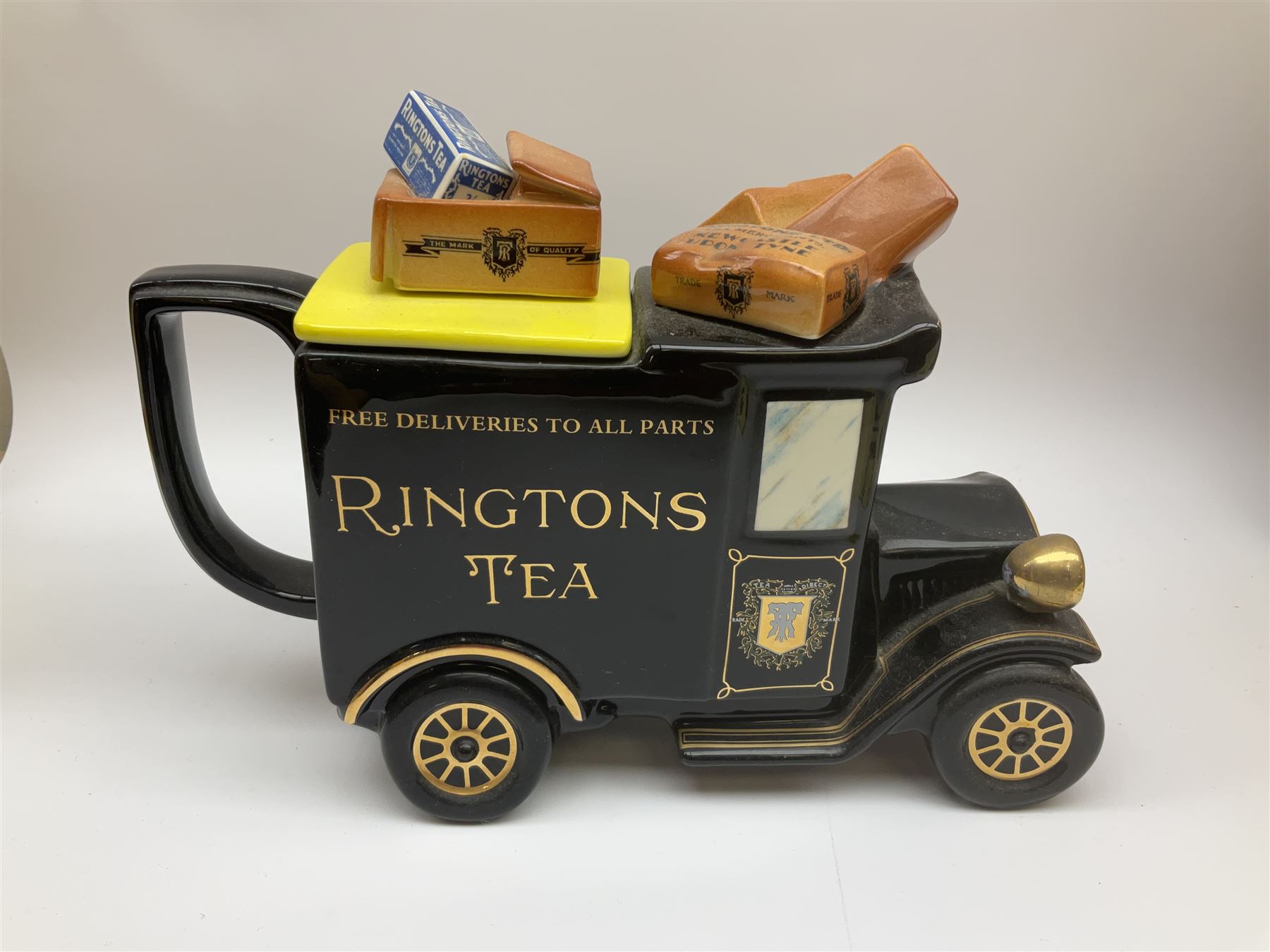 Ringtons novelty teapots, comprising the Ringtons Delivery Van teapot, and the Tea Merchant teapot, both with boxes and certificates of ownership.