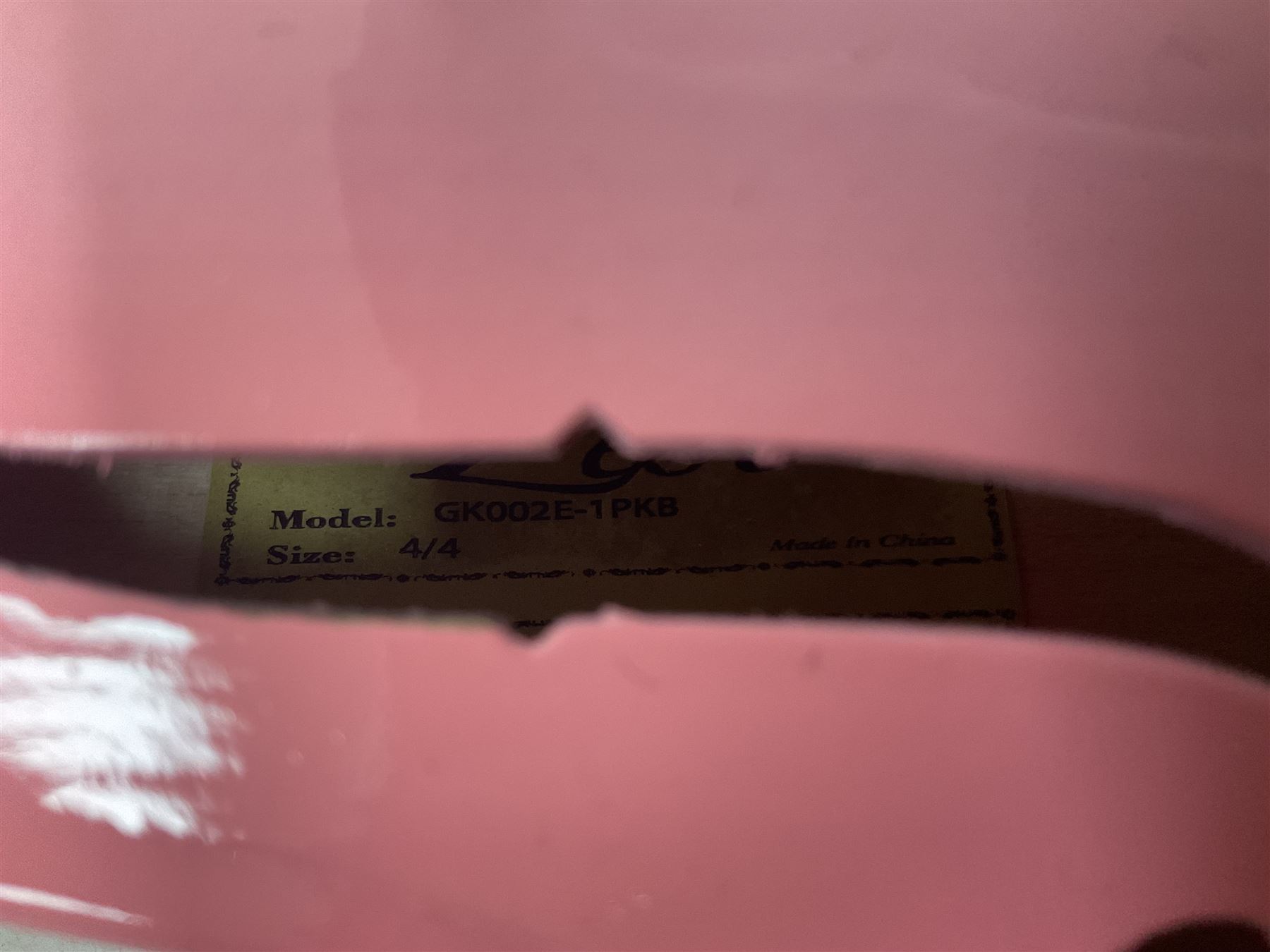 Zest full size pink violin, with a solid wood body and maple head, with matching pink bow and two further bows, in a hard case Length 60cm