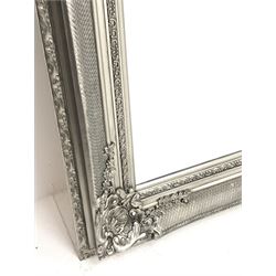 Large rectangular mirror in ornate silvered frame decorated with acanthus scroll shell cartouches and trailing foliage, bevelled plate, 170cm x 200cm