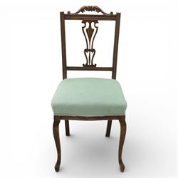 Late Victorian mahogany side chair, the carved cresting rail above a pierced and carved splat with lyre-form detail, the back panel inset with cane work, drop-in upholstered seat in pale green fabric with braid trim, raised on cabriole supports